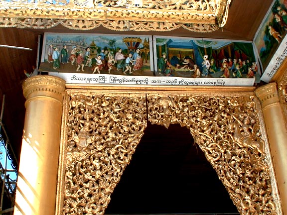 A temple on the west side of the Schwedagon Pagoda decorated with painted bas-reliefs inside and out