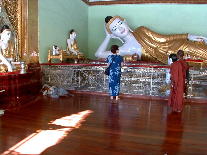Inside a temple: The reclining Buddha resting but not in Nirvana