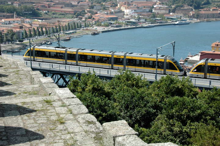 A Subway train about to cross an iron bridge across the Douro River, Portugal