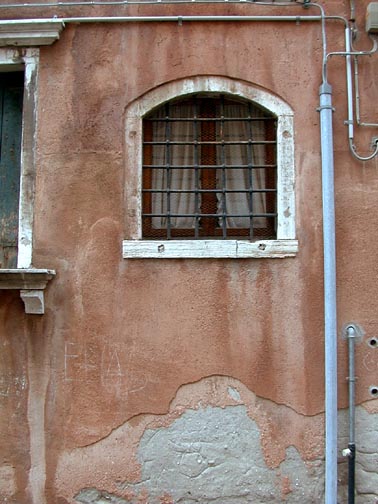 A Picturesque Venetian Window with Bars